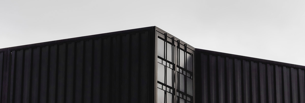 cropped top half view of two shipping containers
